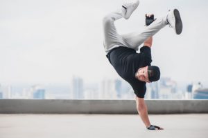 Bboy doing some stunts - Street artist breakdancing outdoors